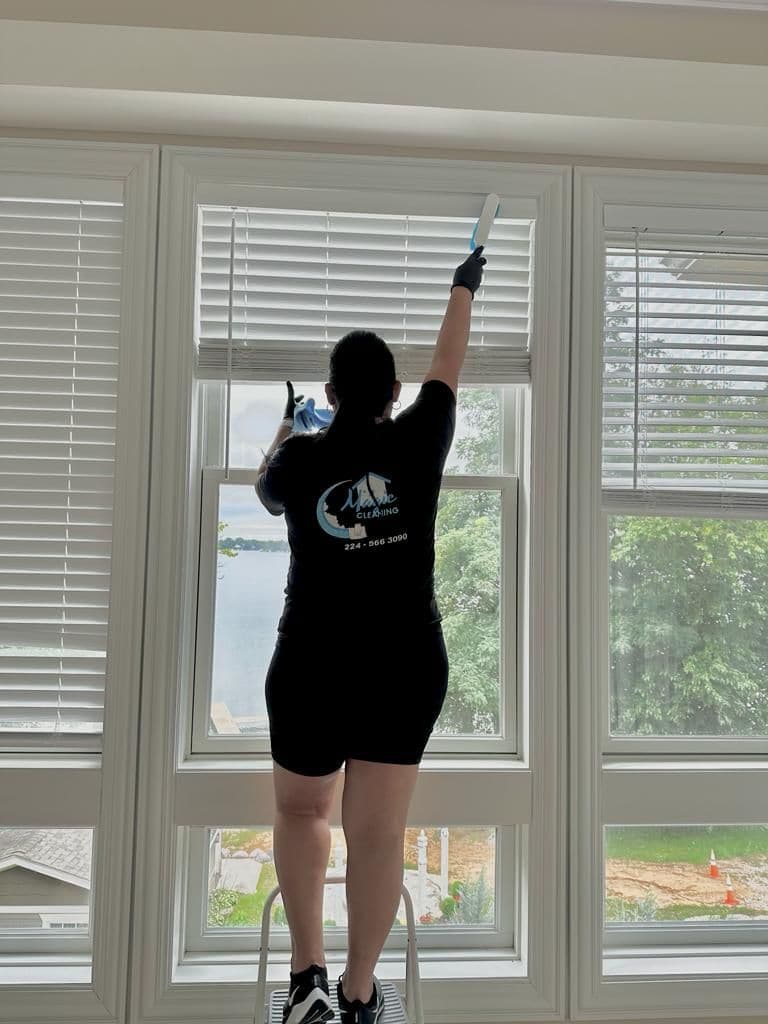 A Magic Cleaning team member cleaning interior windows