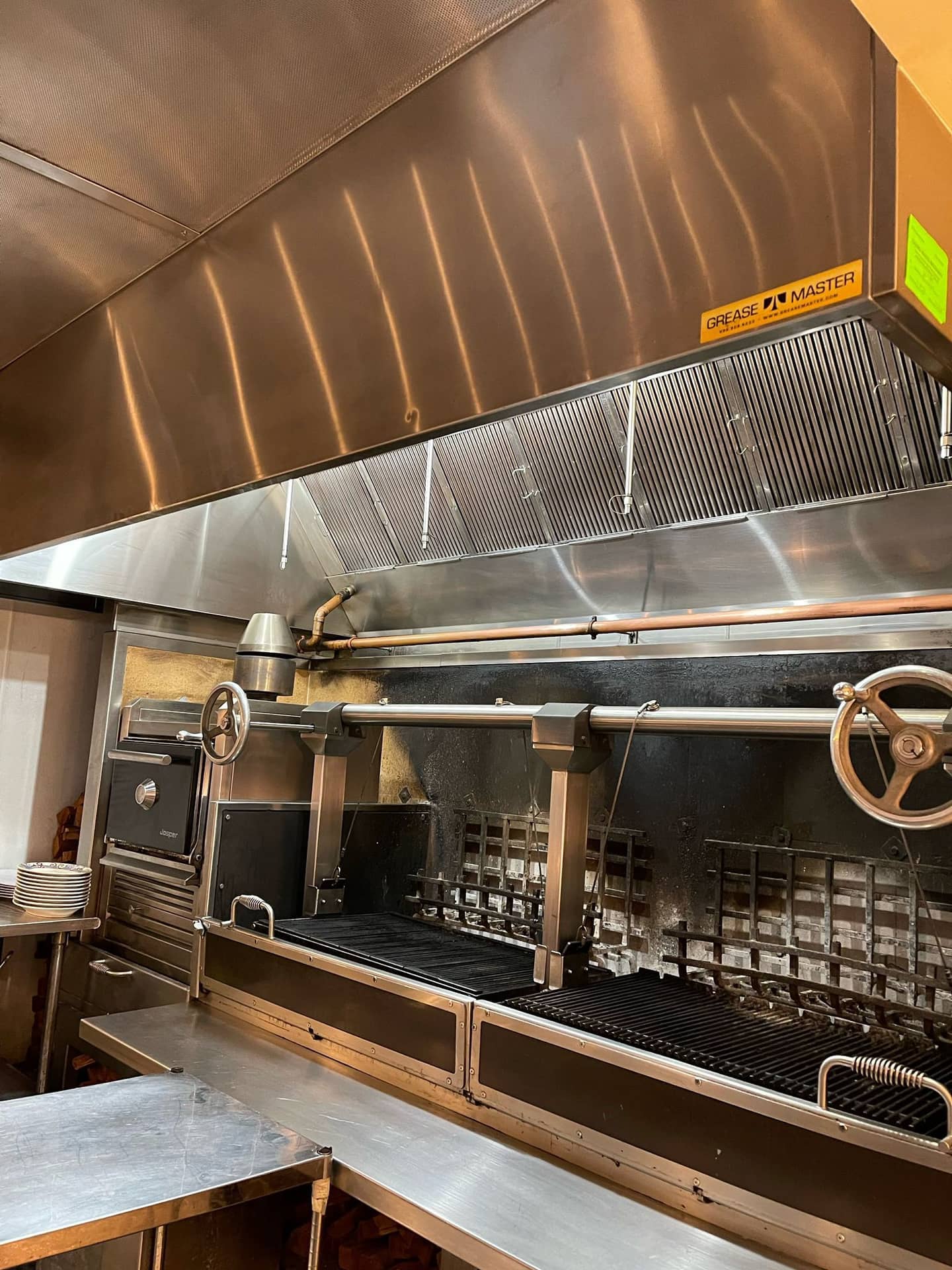 a commercial kitchen hood after cleaning by Magic Cleaning