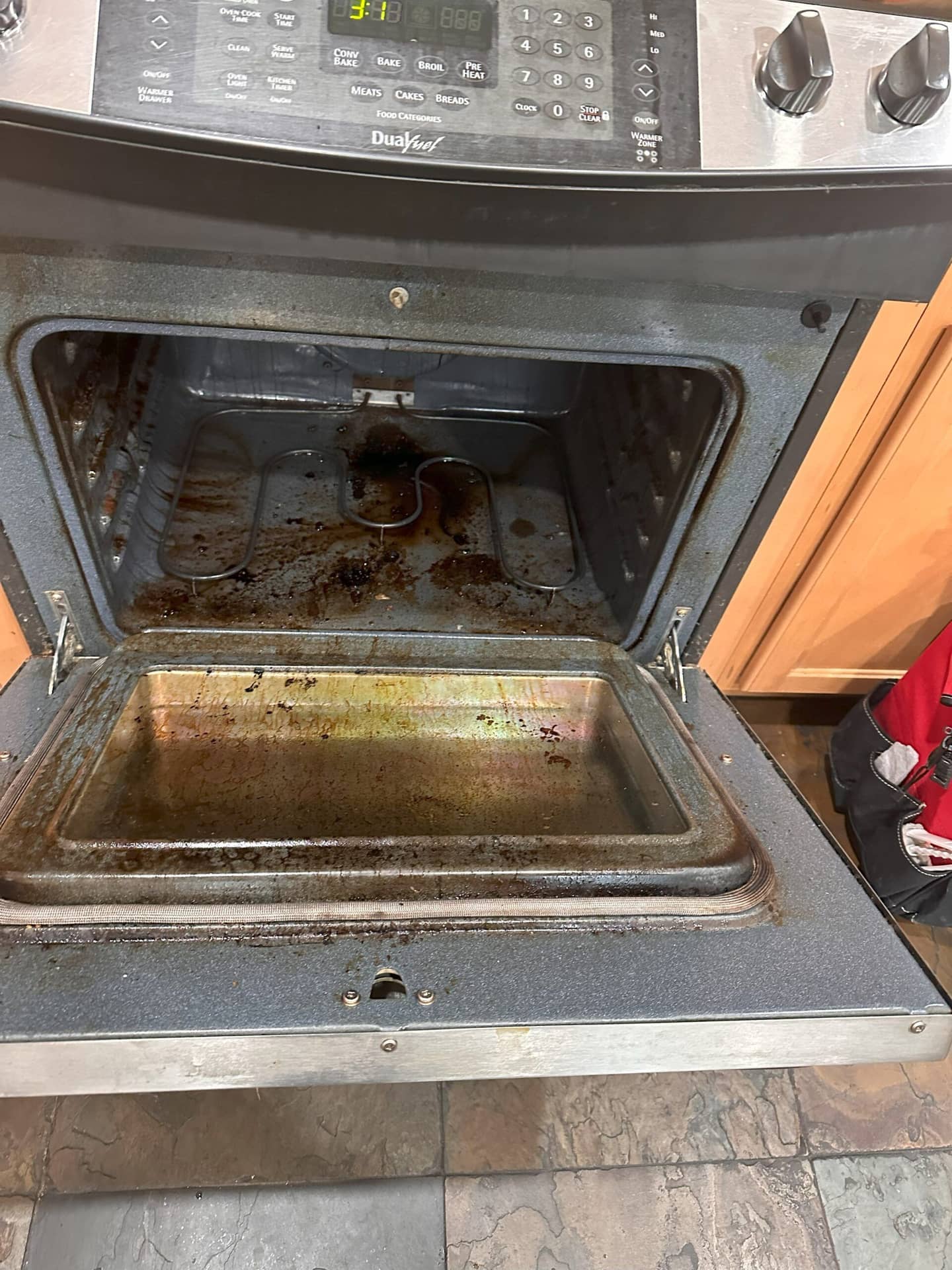an oven before cleaning by Magic Cleaning